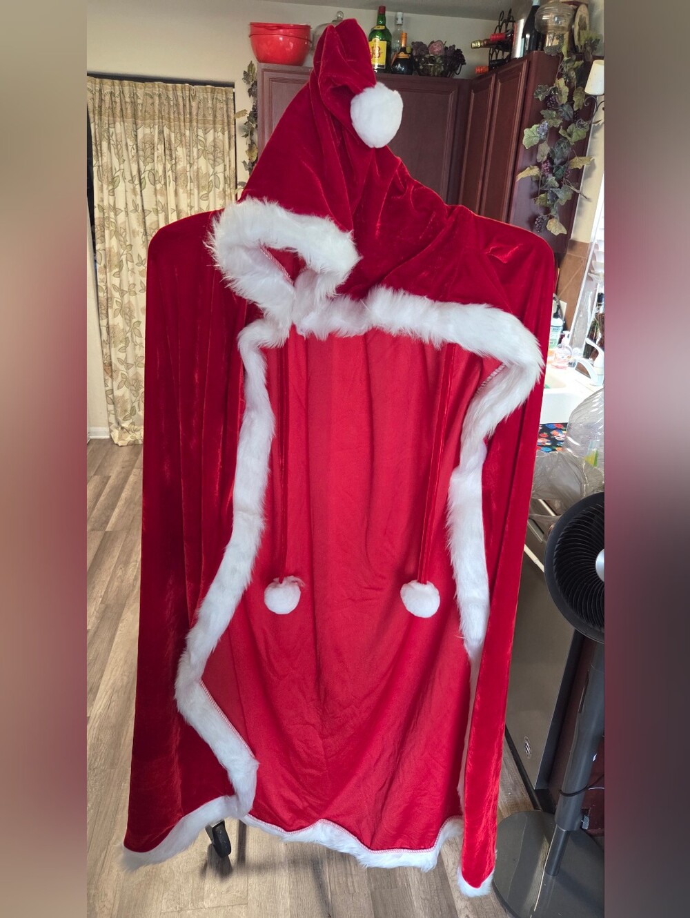 red velvet hooded Santa Claus cape with white faux fur trim. [1] (https://www.wa